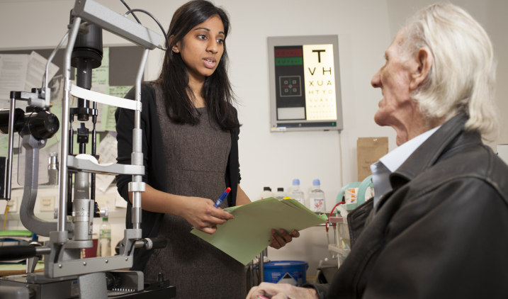 eye doctor with patient eye doctor with patient