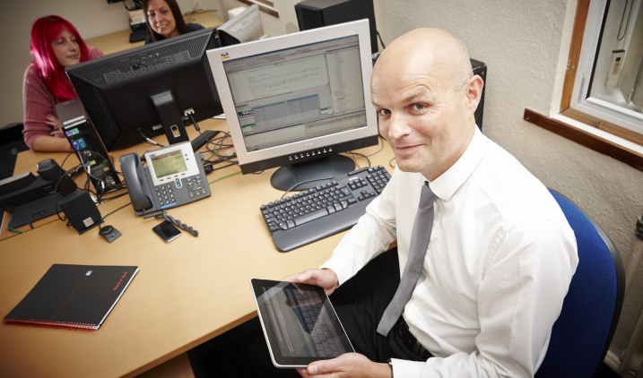 health informatics man with ipad and computer