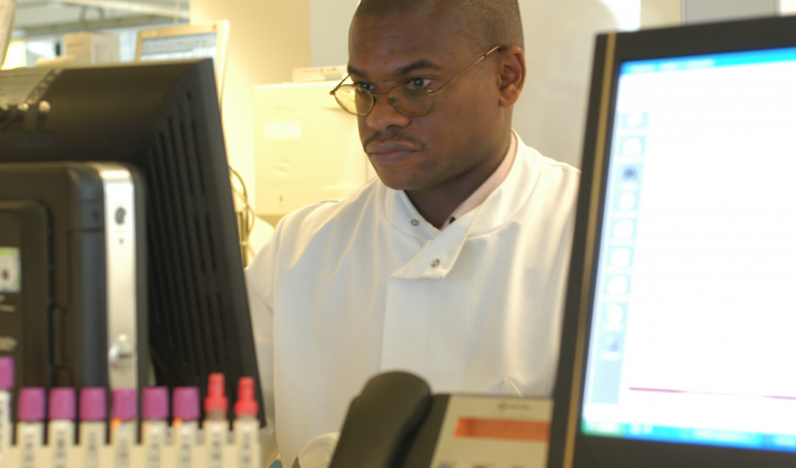 healthcare-science-male-in lab-coat-with-computer