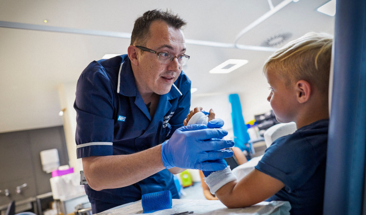 male nurse giving injection male nurse giving injection