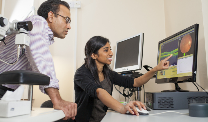 Two doctors looking at a screen Two doctors looking at a screen