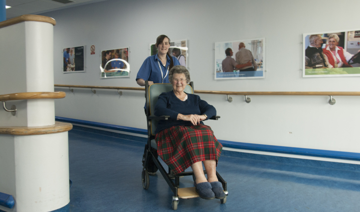 female-pushing-patient-on-wheelchair