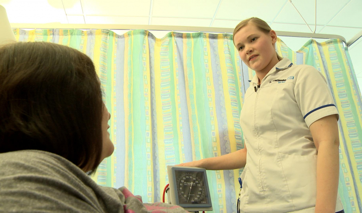 wht-female-support-worker-with-patient wht-female-support-worker-with-patient