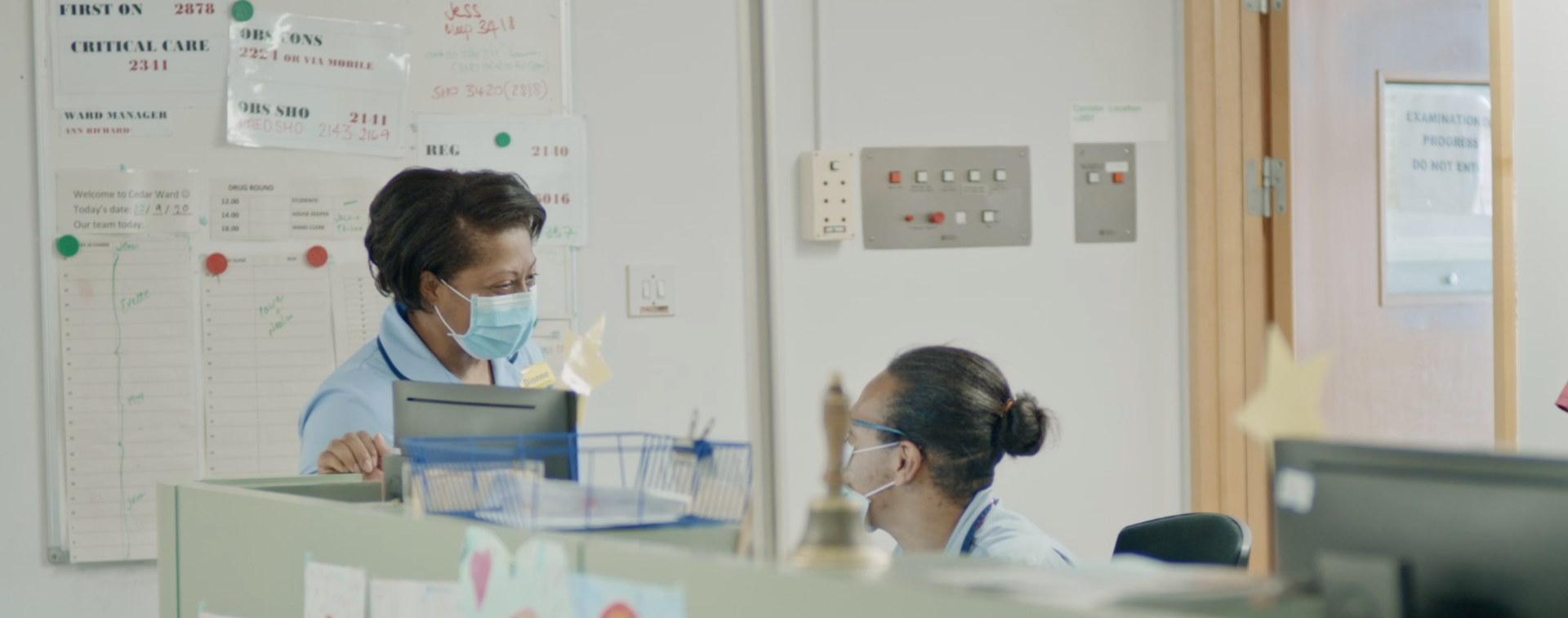 two healthcare supportworkers talking