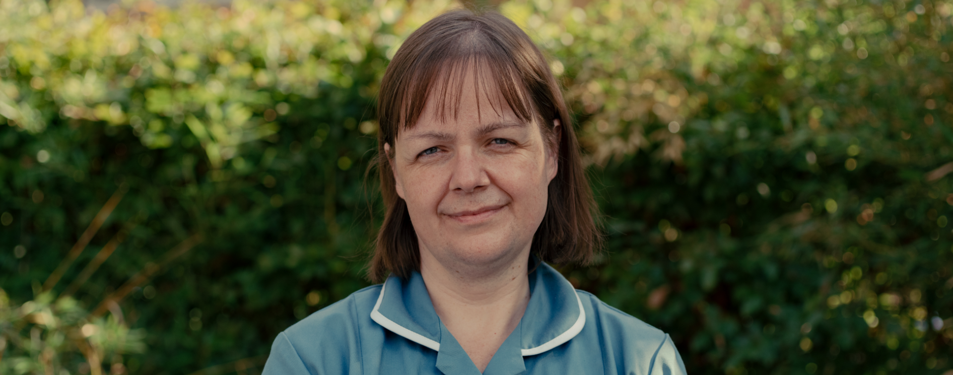 nurse smiling at camera