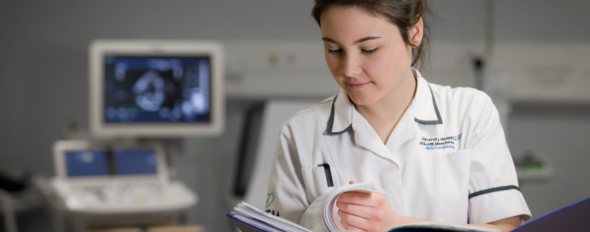 cardiac scientist looking at folder