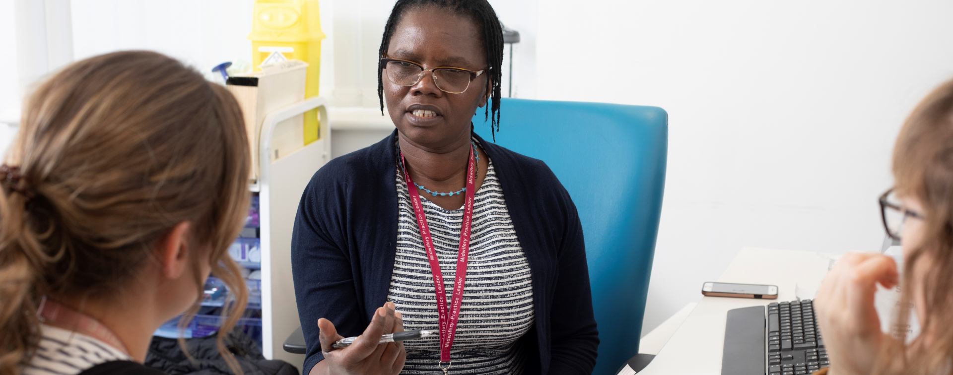 midwife with colleagues talking