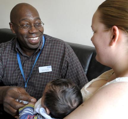 health visitor with mum and baby health visitor with mum and baby