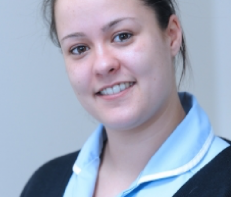 healthcare support worker smiling to camera Read Emma's story