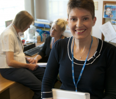 nhs manager smiling to camera