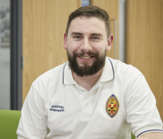 Physiotherapist smiling at camera