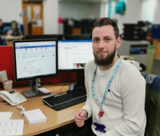 man sitting in front of computer