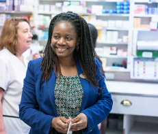 pharmacist standing in pharmacy